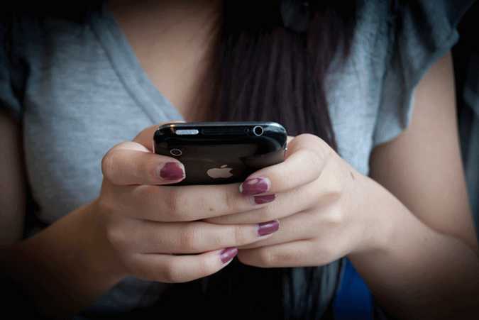 A teen on her smartphone