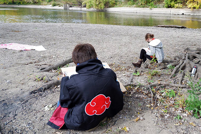 young people outside drawing